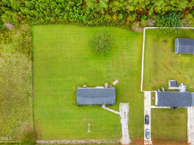 a view of a swimming pool with a yard