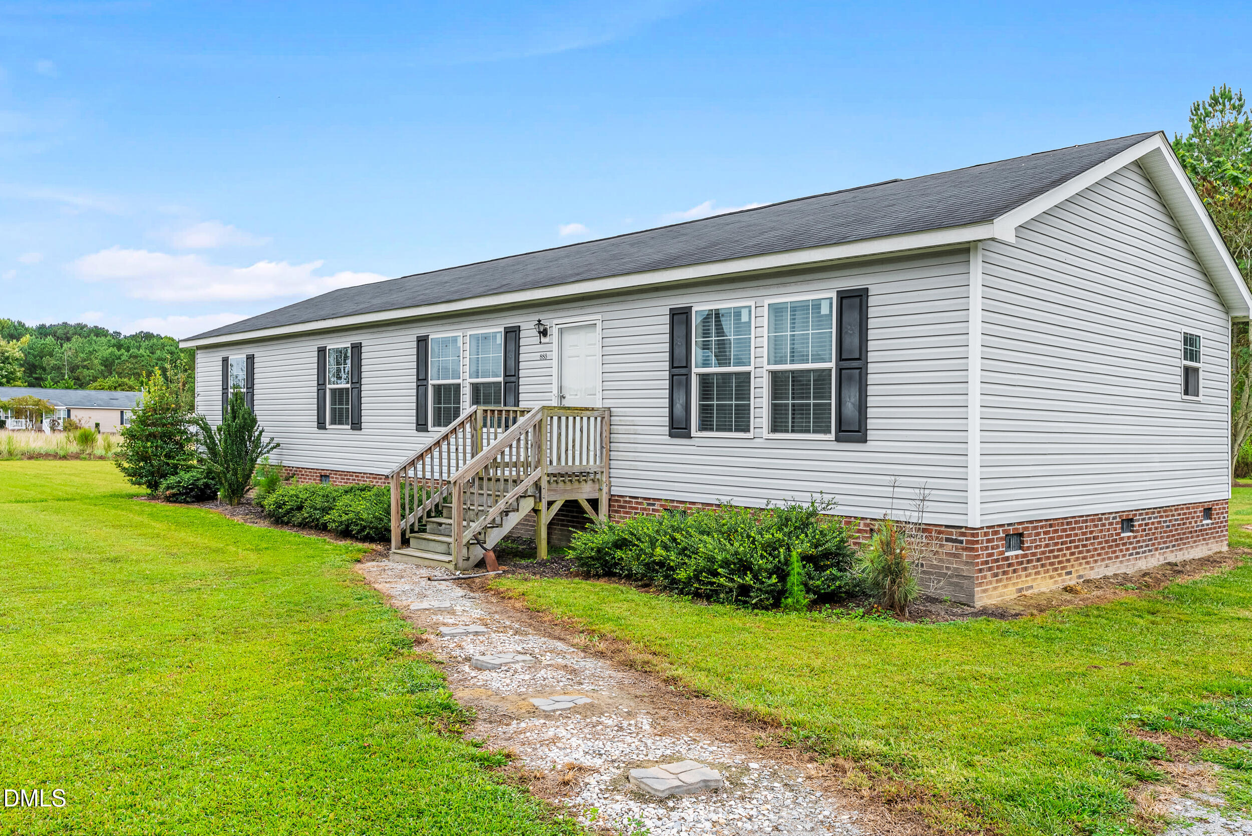 883 Low Ground Road Enfield, NC 27823 - Photo 3 of 26 a view of a house with backyard and garden