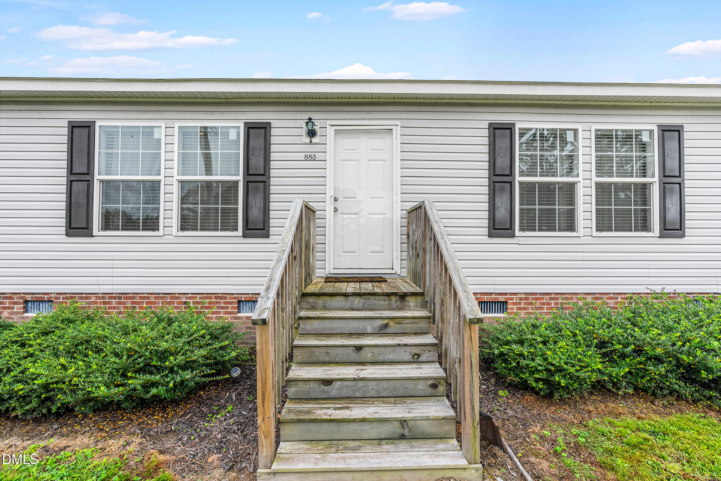 883 Low Ground Road Enfield, NC 27823 - Photo 4 of 26 a view of a house with more windows and plants