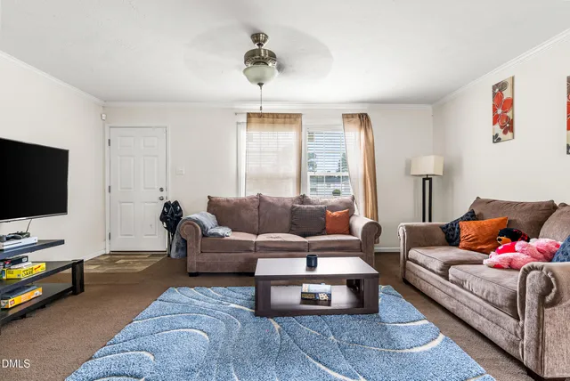 a living room with furniture and a couch