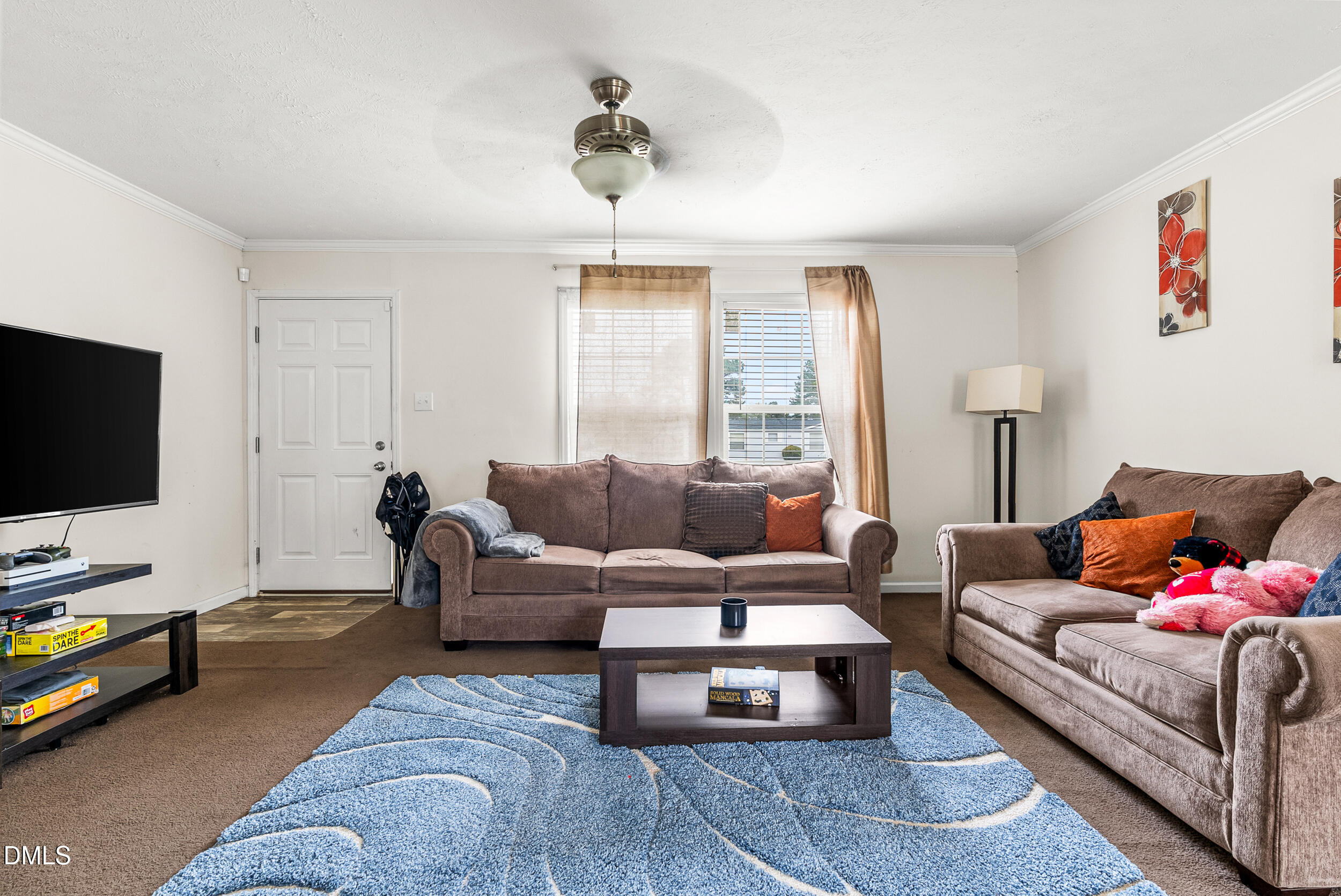 883 Low Ground Road Enfield, NC 27823 - Photo 6 of 26 a living room with furniture and a flat screen tv