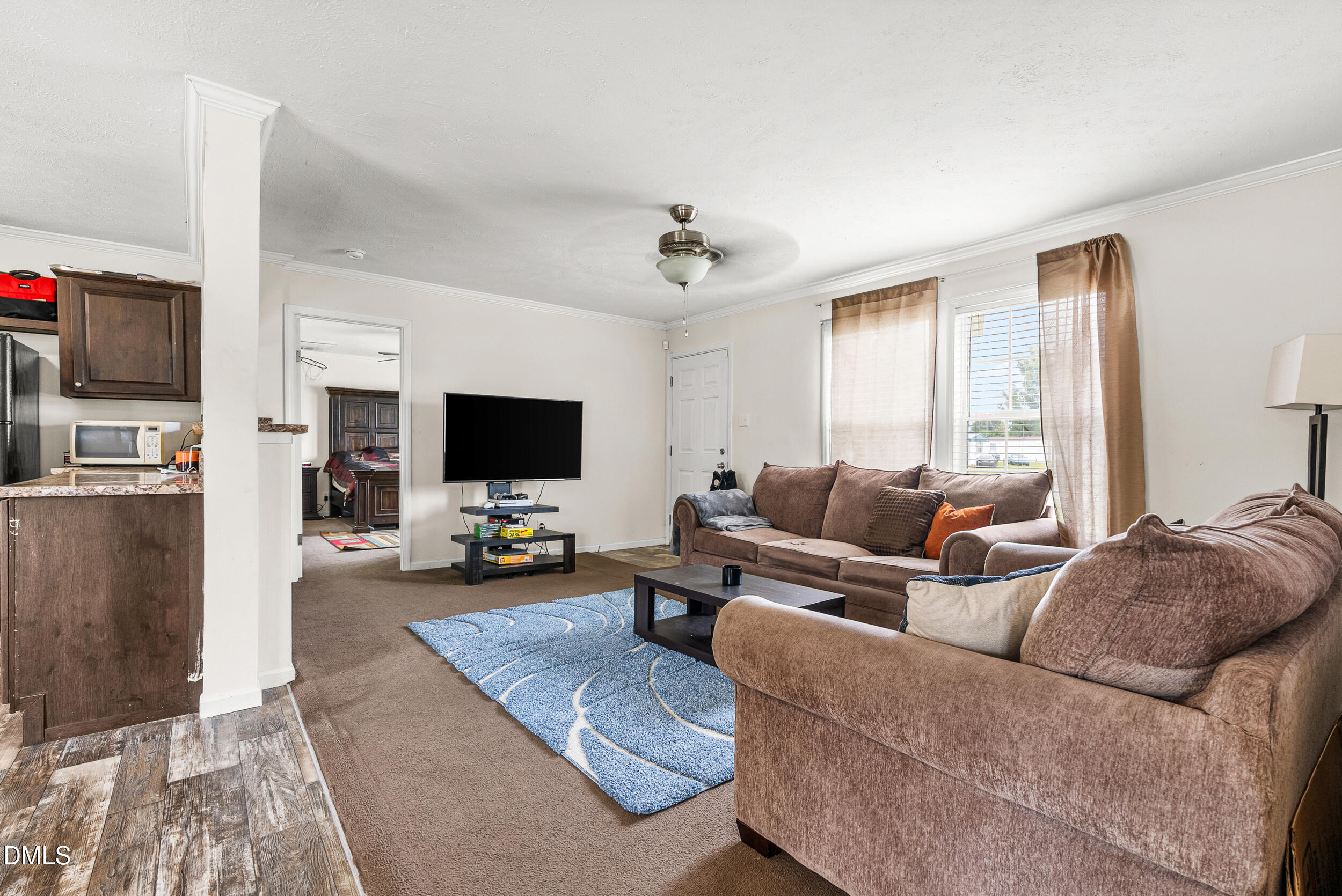 883 Low Ground Road Enfield, NC 27823 - Photo 7 of 26 a living room with furniture and a flat screen tv