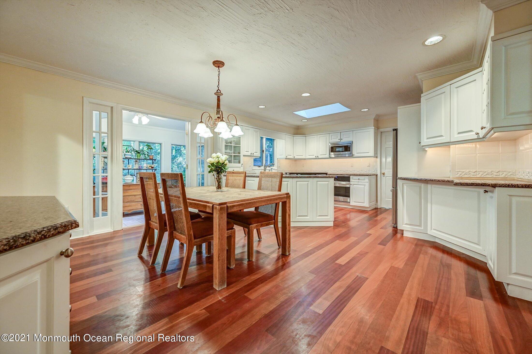 10 Crowfield Lane Holmdel, NJ 07733 - Photo 12 of 52 a view of a dining room with furniture window and wooden floor