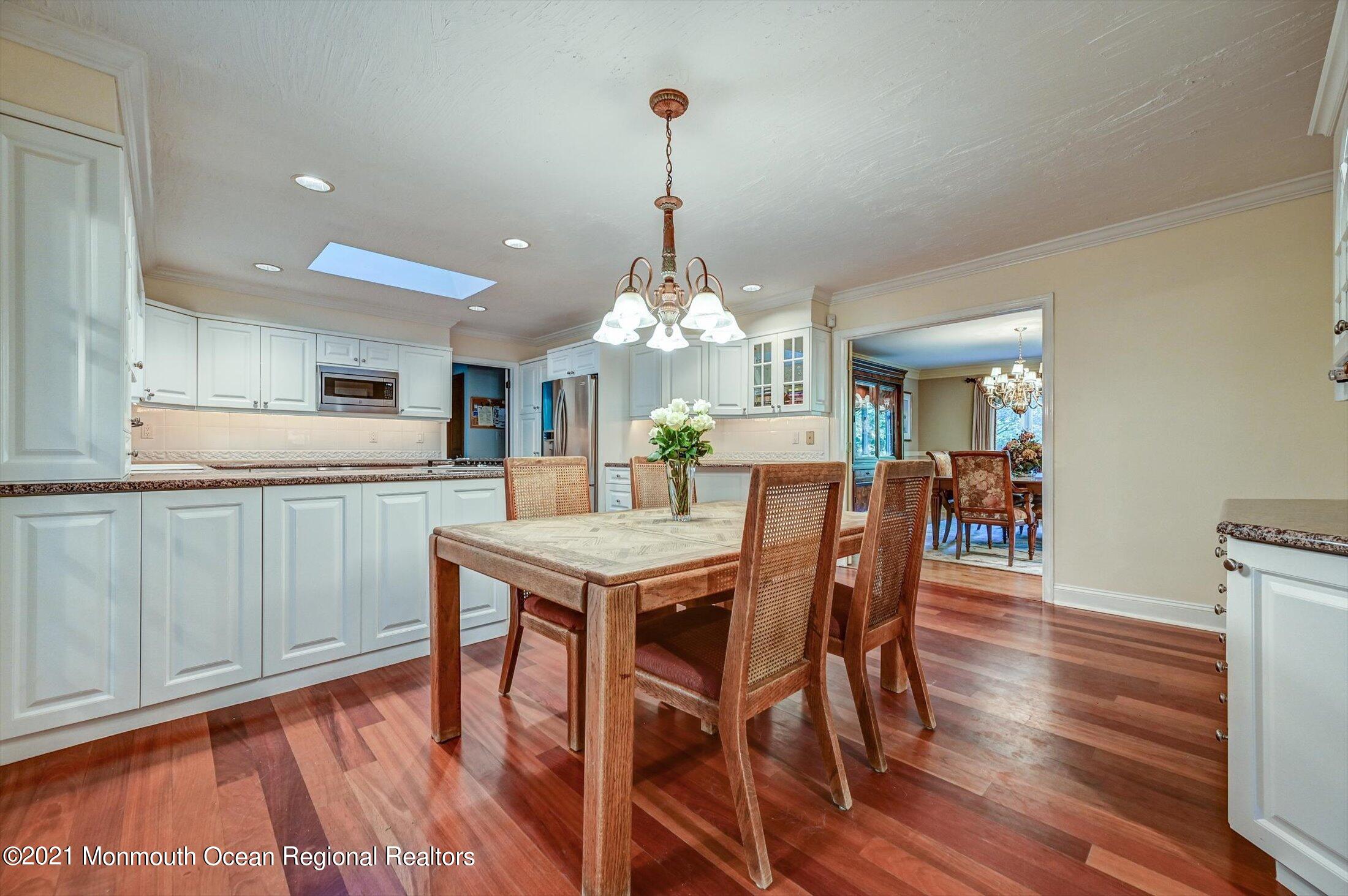 10 Crowfield Lane Holmdel, NJ 07733 - Photo 13 of 52 a view of a dining room with furniture window and wooden floor