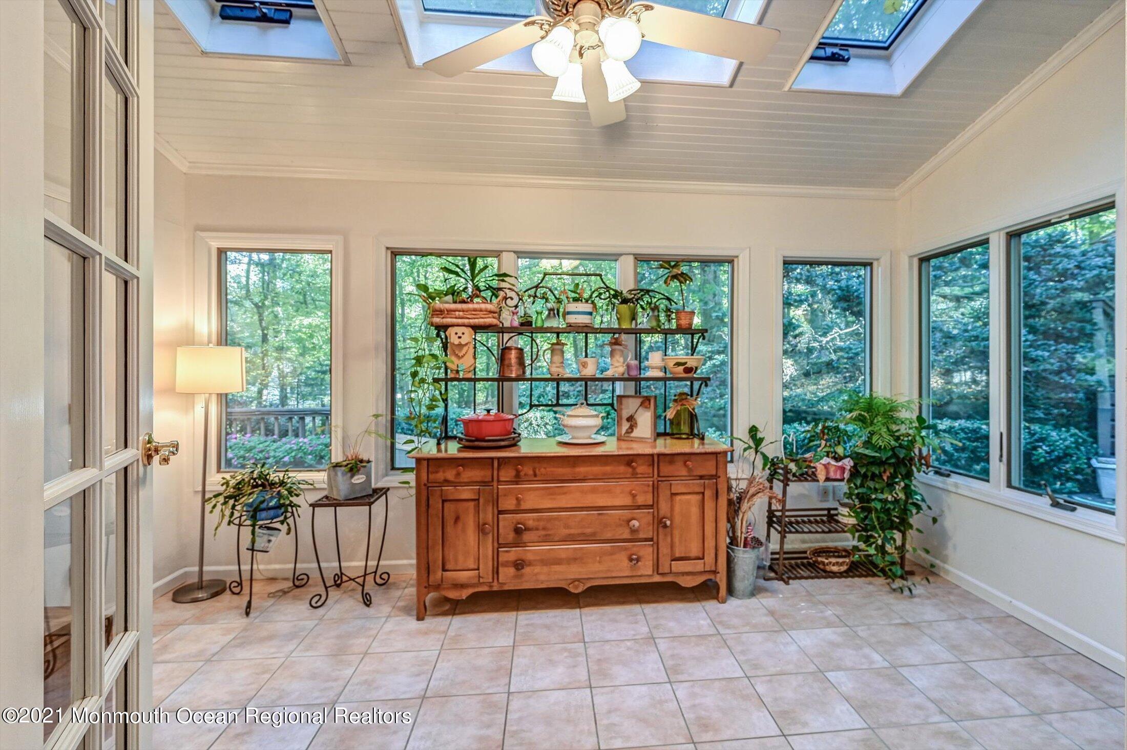 10 Crowfield Lane Holmdel, NJ 07733 - Photo 17 of 52 a room with furniture and a fireplace