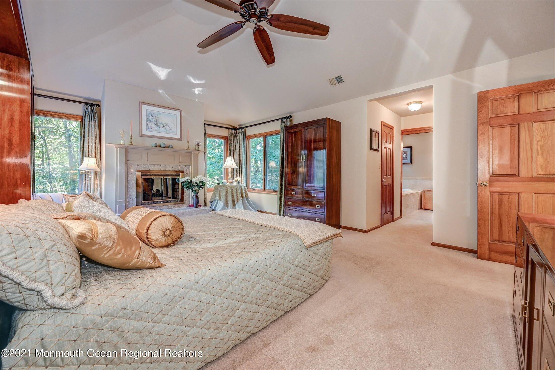 10 Crowfield Lane Holmdel, NJ 07733 - Photo 21 of 52 a view of a livingroom with furniture and a fireplace