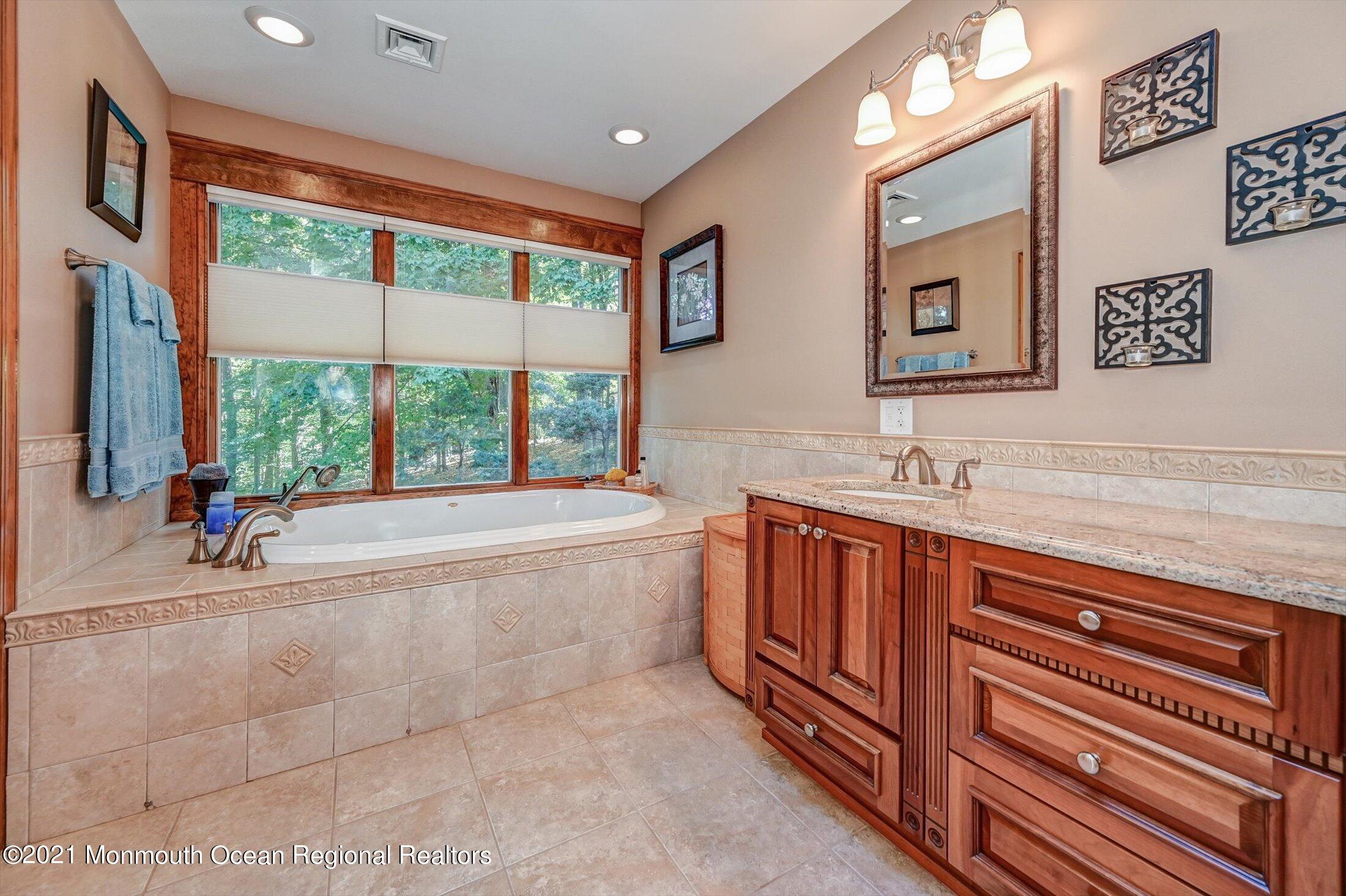 10 Crowfield Lane Holmdel, NJ 07733 - Photo 24 of 52 a spacious bathroom with sink and bathtub