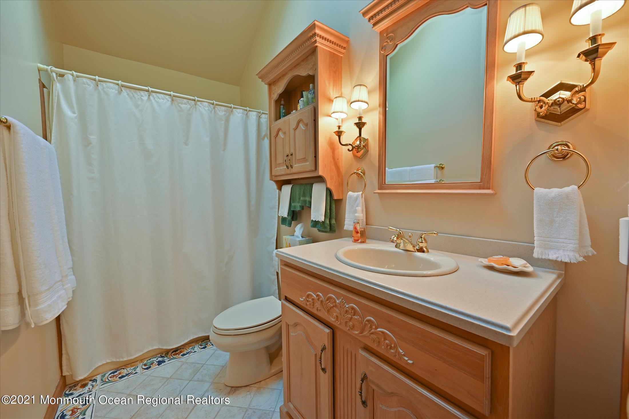 10 Crowfield Lane Holmdel, NJ 07733 - Photo 27 of 52 a bathroom with a sink toilet and shower