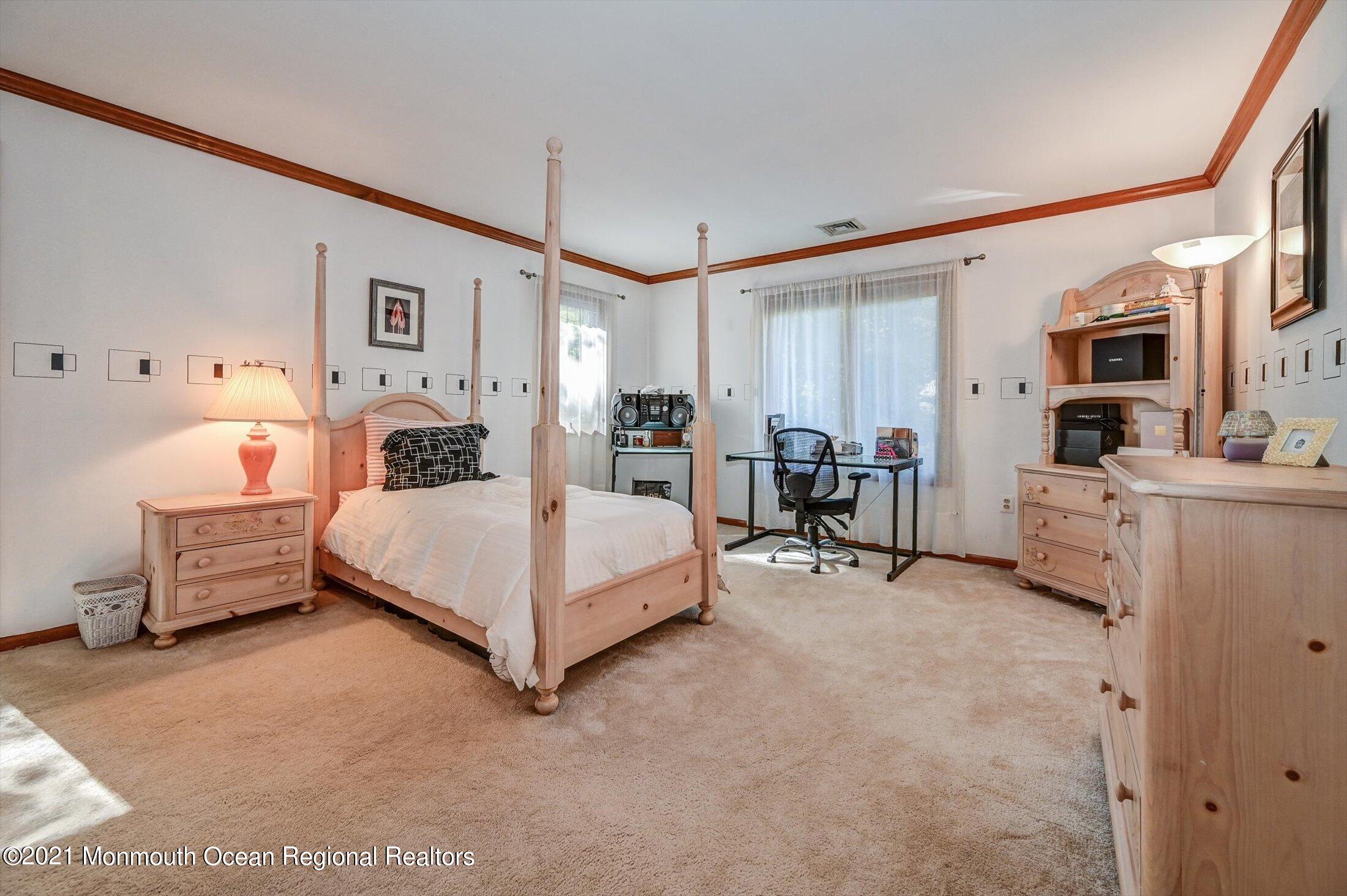 10 Crowfield Lane Holmdel, NJ 07733 - Photo 28 of 52 a bedroom with furniture and white walls
