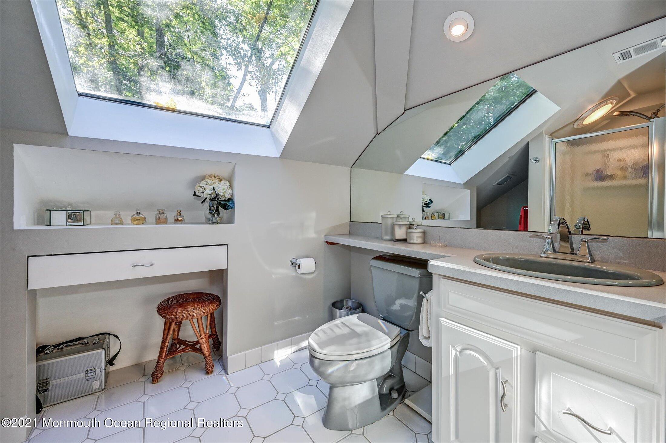 10 Crowfield Lane Holmdel, NJ 07733 - Photo 29 of 52 a bathroom with a sink toilet and shower