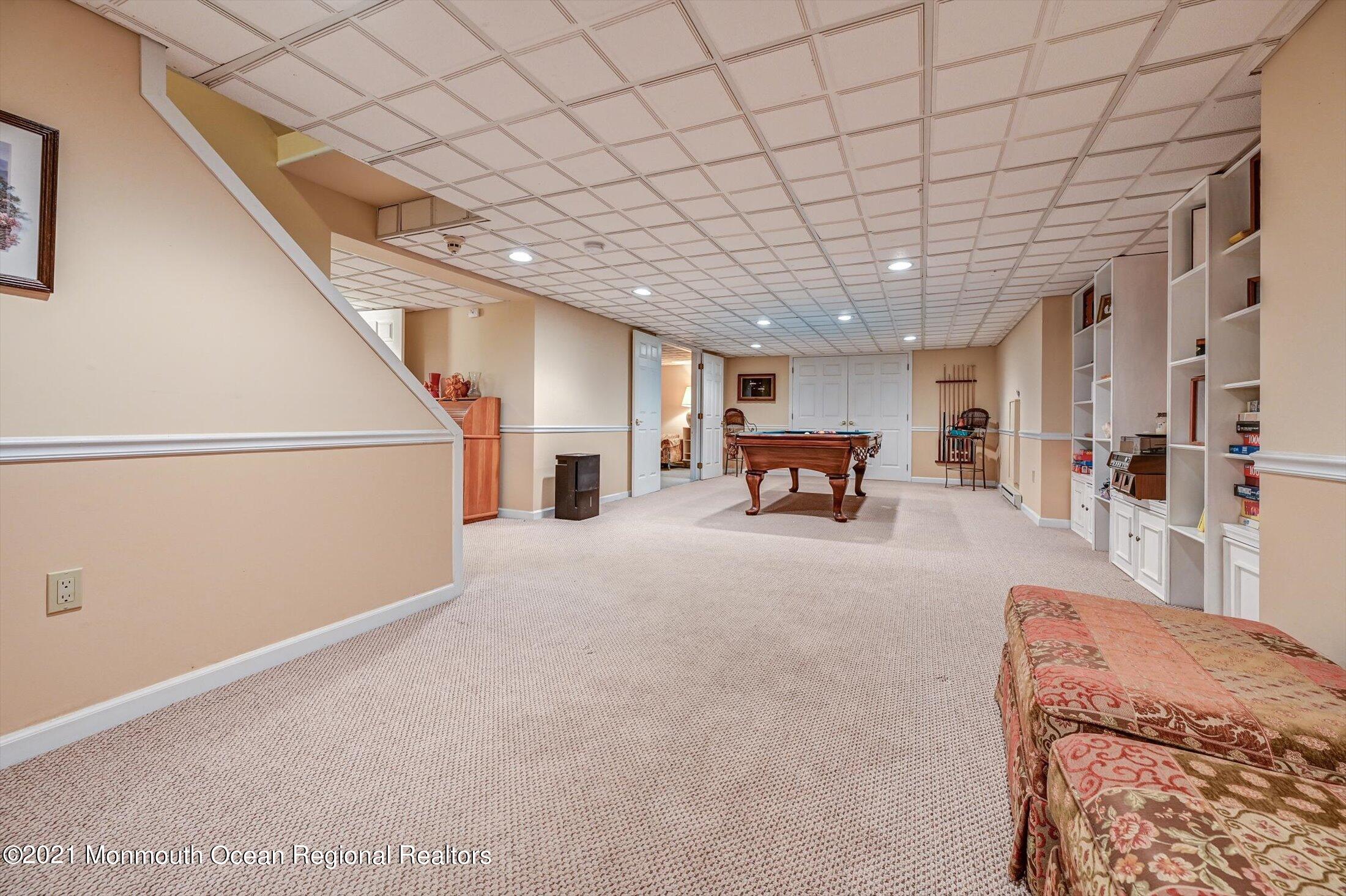10 Crowfield Lane Holmdel, NJ 07733 - Photo 30 of 52 a bedroom with furniture and white walls