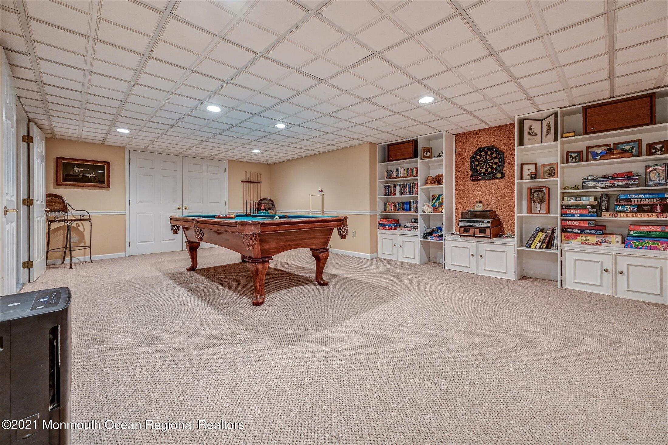 10 Crowfield Lane Holmdel, NJ 07733 - Photo 31 of 52 a bathroom with a sink a toilet and mirror