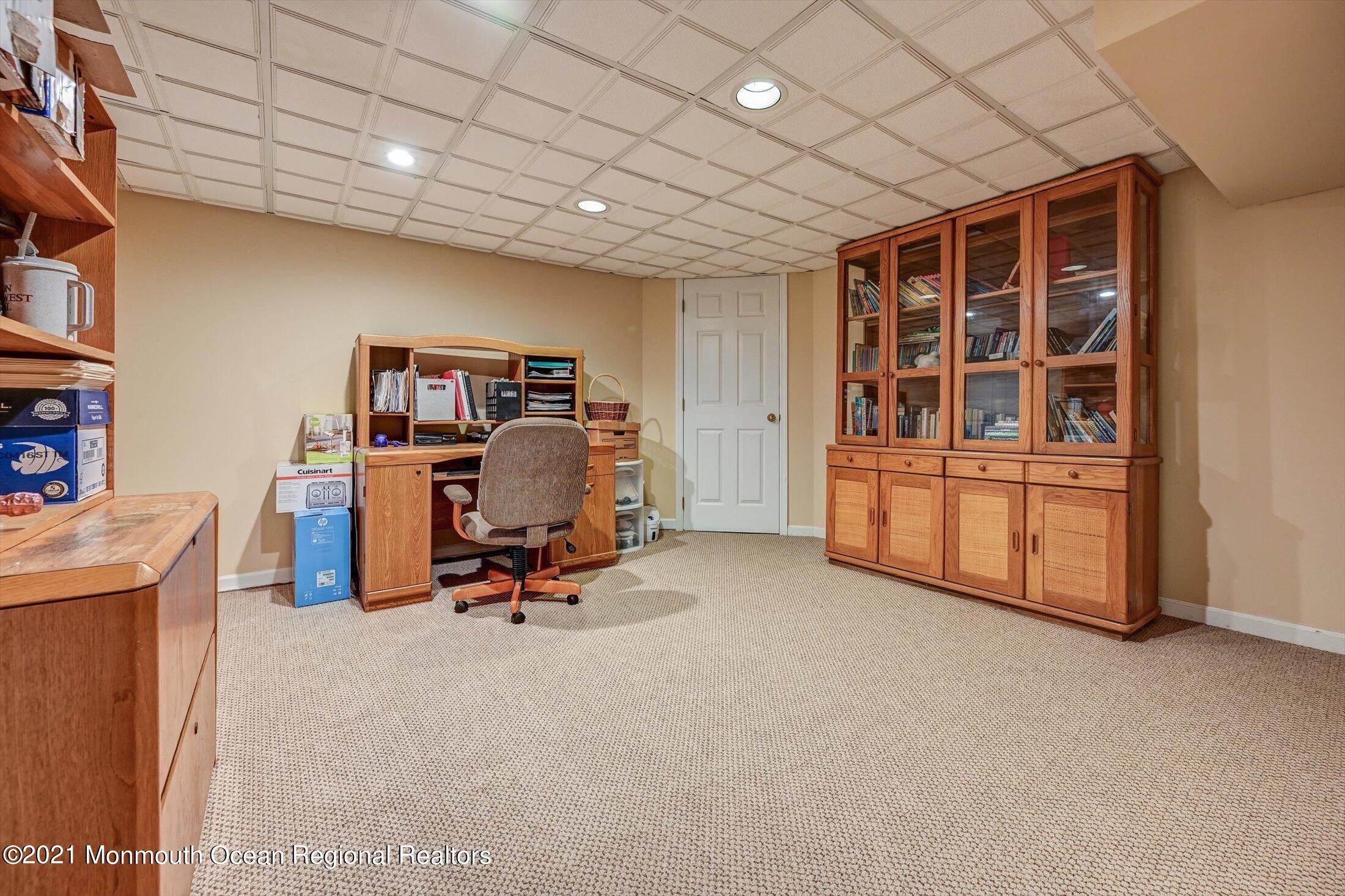 10 Crowfield Lane Holmdel, NJ 07733 - Photo 34 of 52 a bathroom with a toilet sink and mirror