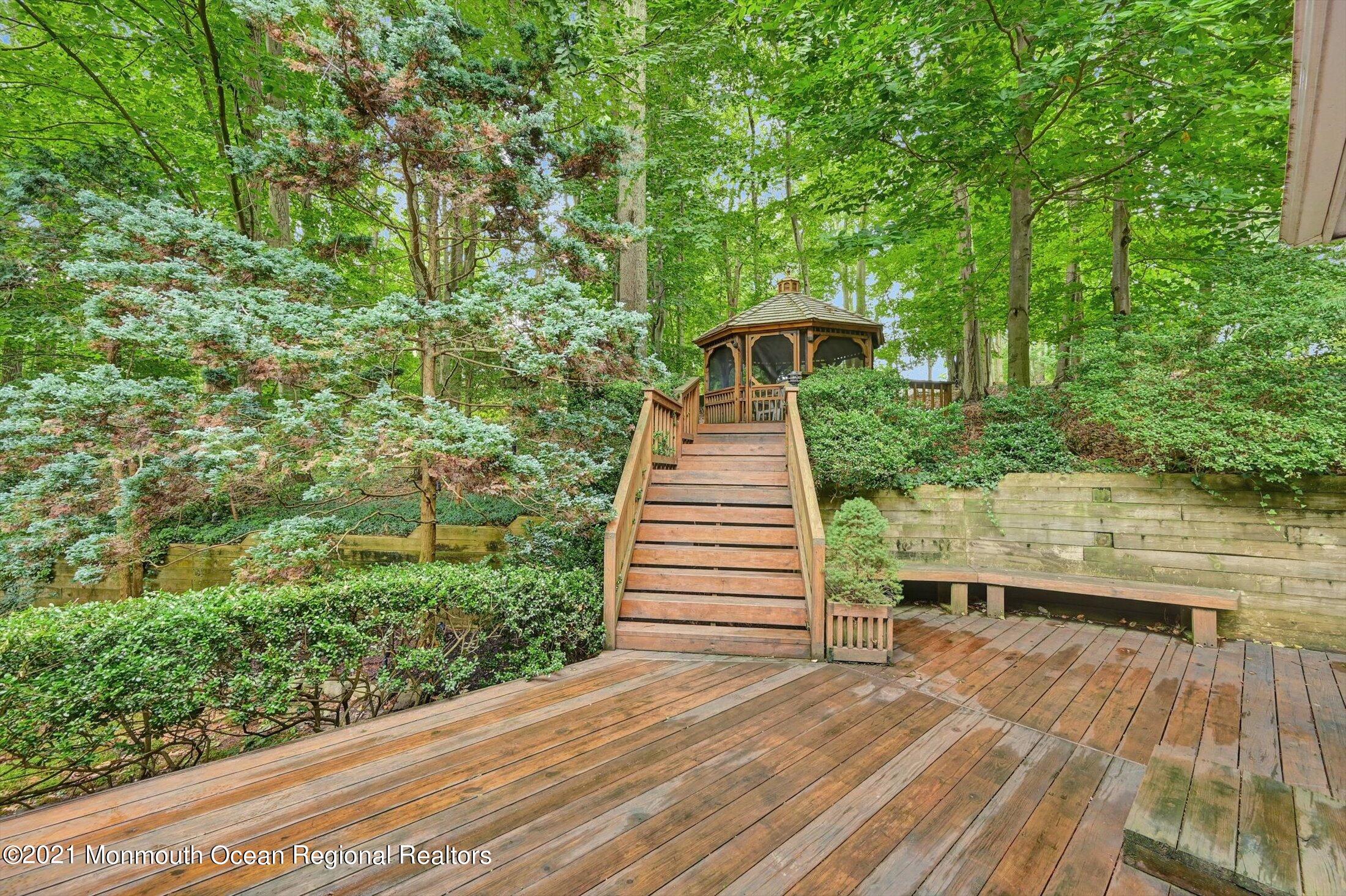 10 Crowfield Lane Holmdel, NJ 07733 - Photo 40 of 52 a view of balcony with deck and yard