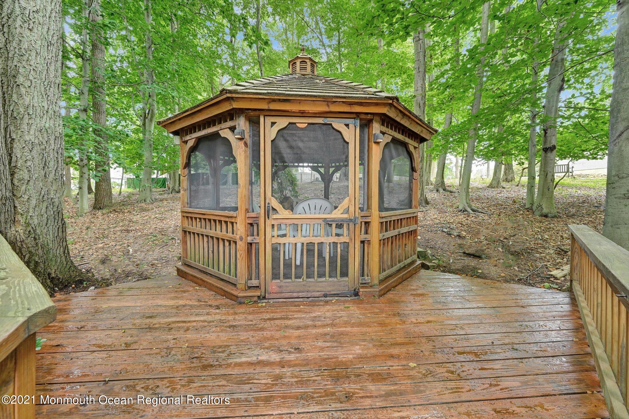 10 Crowfield Lane Holmdel, NJ 07733 - Photo 41 of 52 a view of balcony with wooden floor and seating space