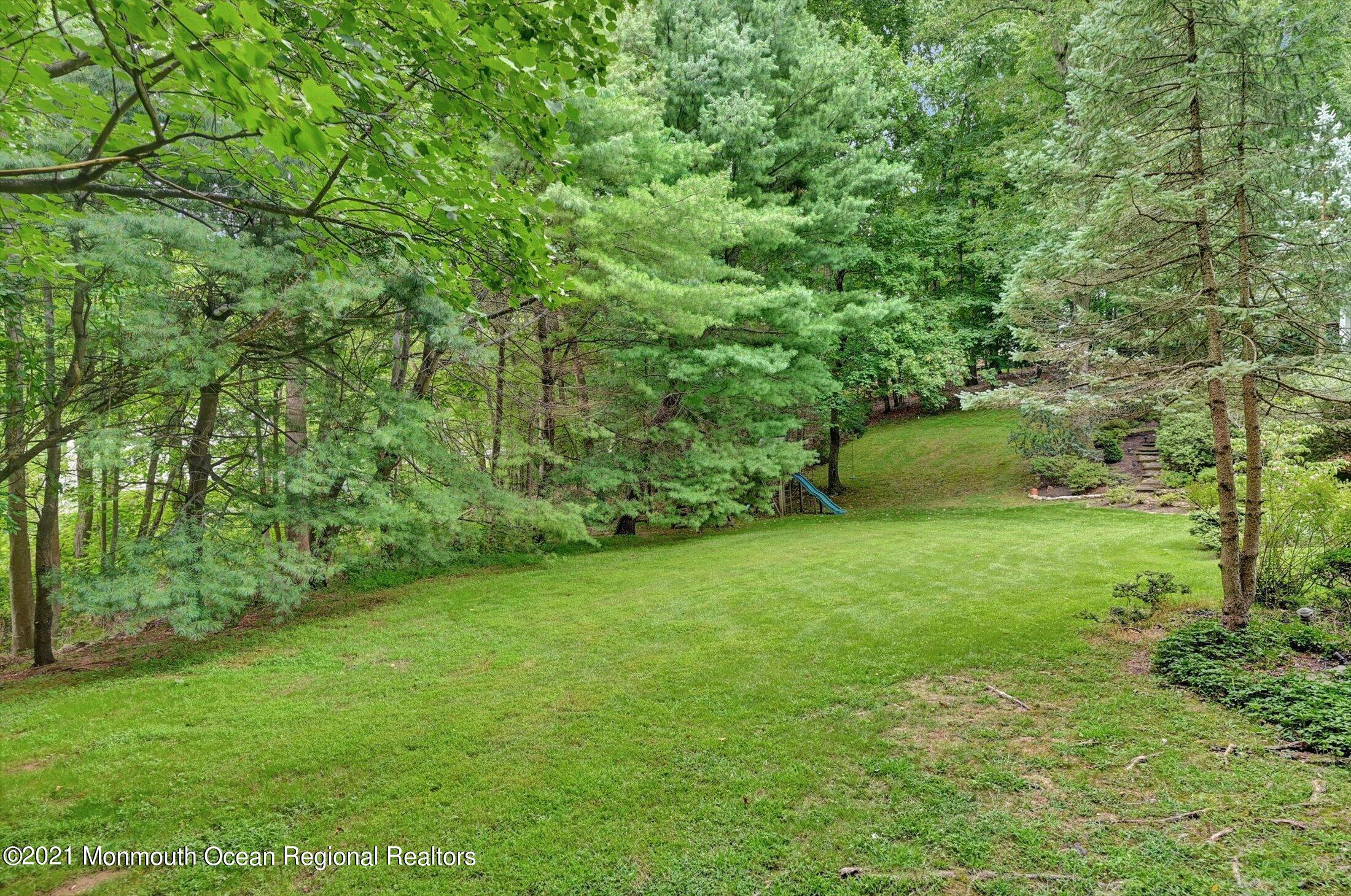 10 Crowfield Lane Holmdel, NJ 07733 - Photo 44 of 52 a view of a chairs and table in the balcony