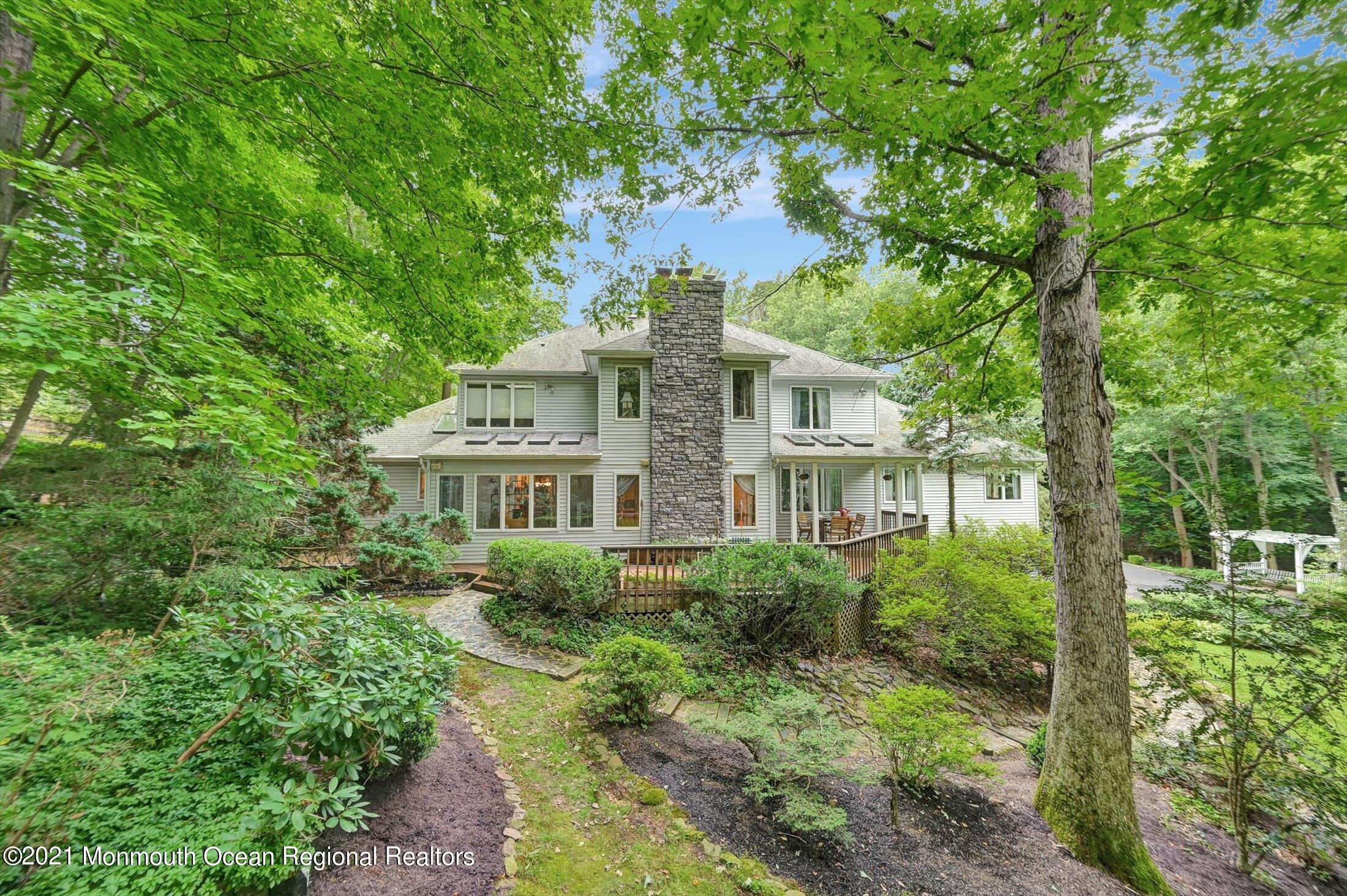 10 Crowfield Lane Holmdel, NJ 07733 - Photo 46 of 52 a view of a lush green space