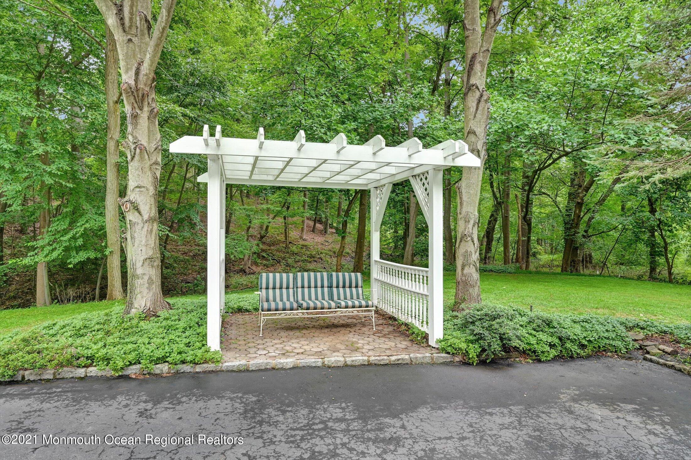 10 Crowfield Lane Holmdel, NJ 07733 - Photo 48 of 52 a front view of a house with garden