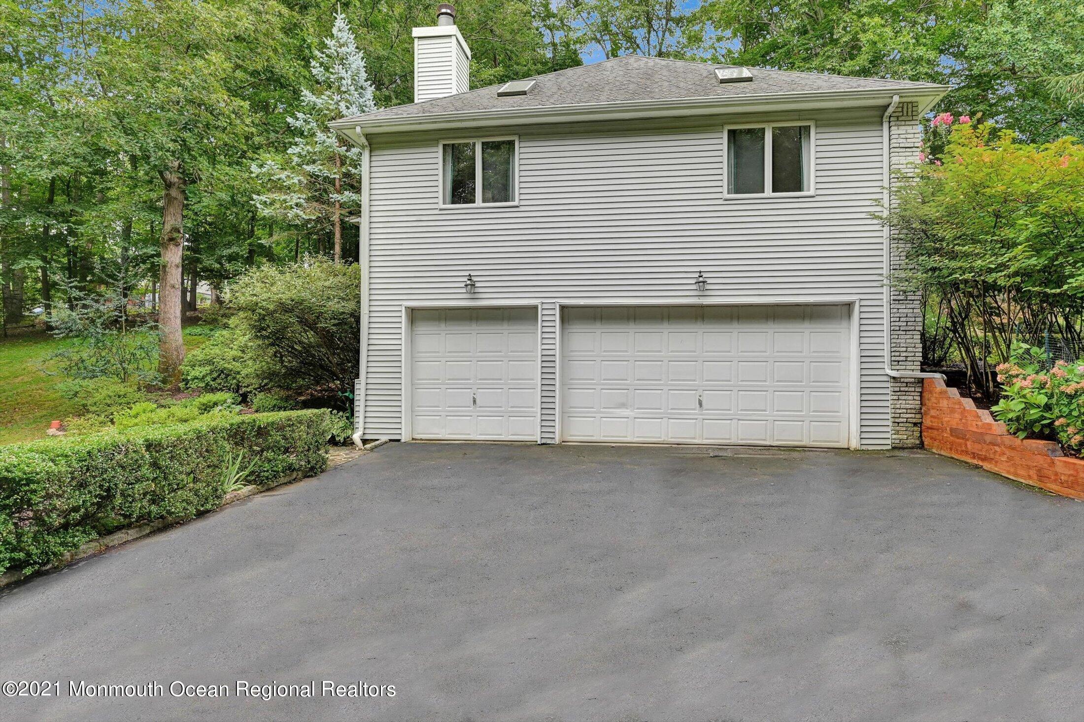 10 Crowfield Lane Holmdel, NJ 07733 - Photo 49 of 52 a view of a field of grass and a tree
