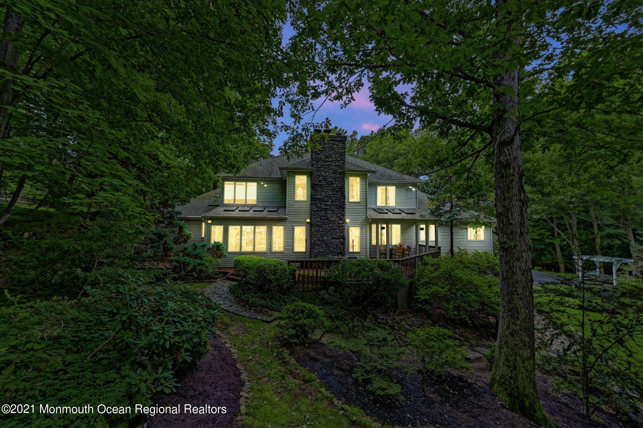 10 Crowfield Lane Holmdel, NJ 07733 - Photo 51 of 52 a front view of a house with a yard