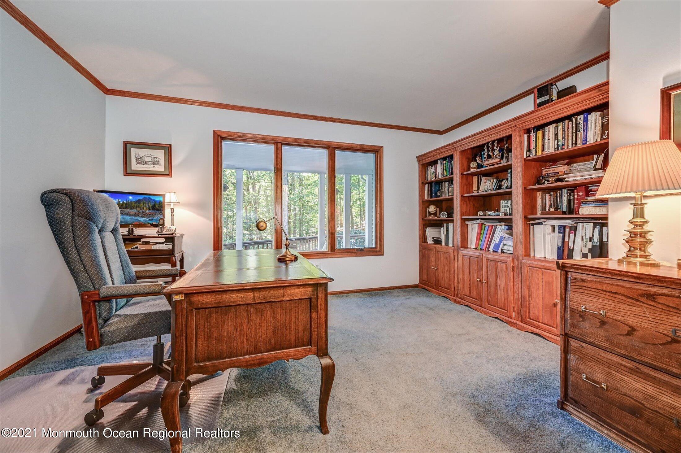 10 Crowfield Lane Holmdel, NJ 07733 - Photo 8 of 52 a room with furniture window and book shelf