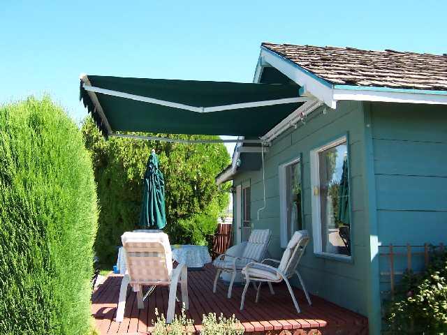 3421 Scoon Road Sunnyside, WA 98944 - Photo 3 of 7 a backyard of a house with table and chairs