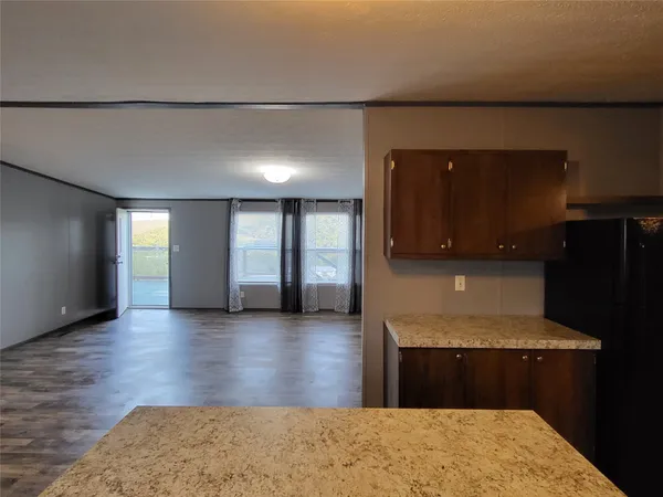 a view of a kitchen with a sink and a stove