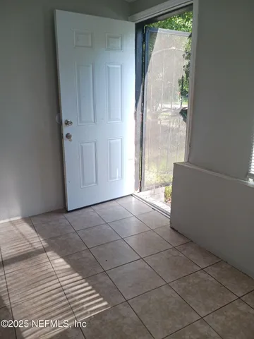 a view of an empty room and window