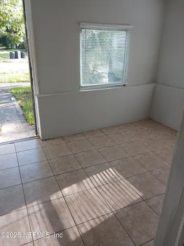 a view of an empty room and window