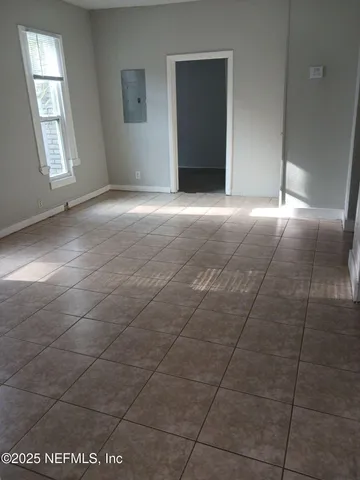 a view of an empty room with a window