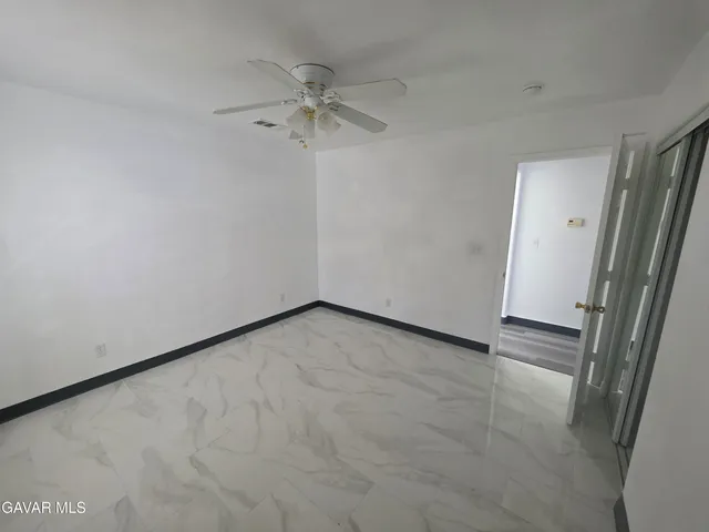 an empty room with a mirror