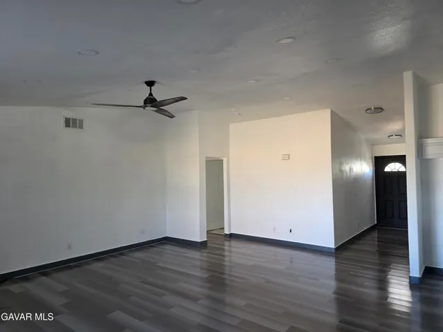 a view of a livingroom with wooden floor