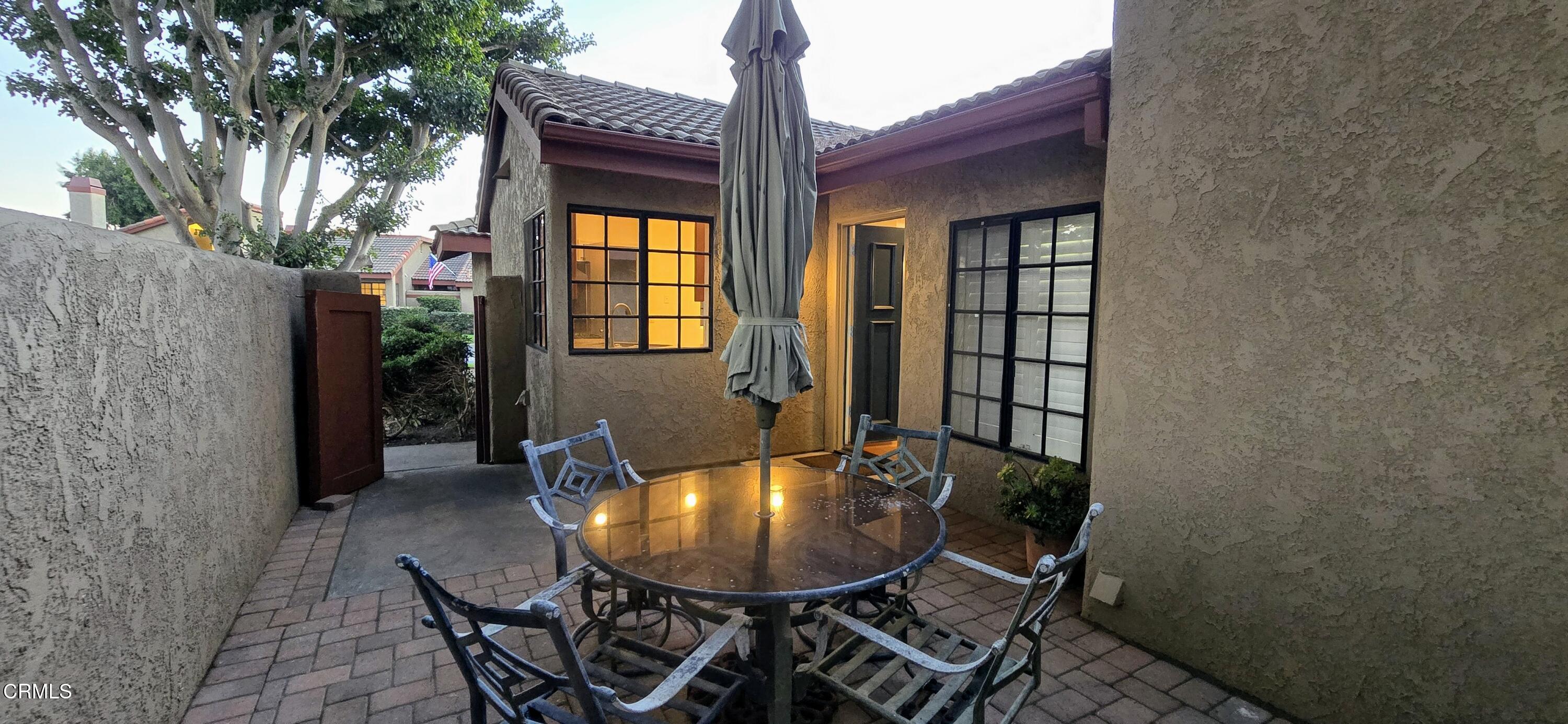 3701 Via Pacifica Walk Oxnard, CA 93035 - Photo 4 of 49 a view of a balcony with table and chairs