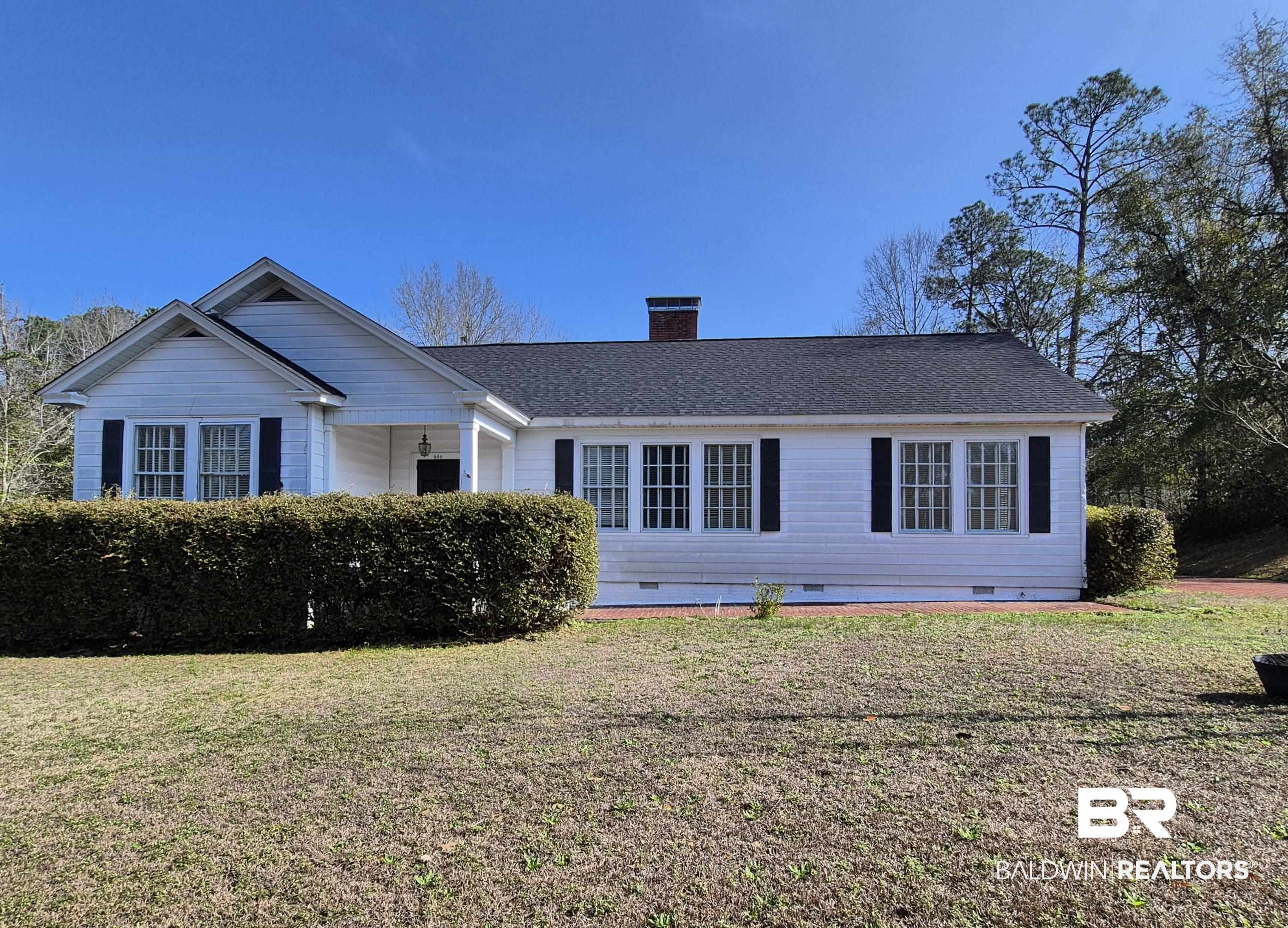 308 Rural Street Evergreen, AL 36401 - Photo 1 of 40 Ranch-style house featuring crawl space, a front lawn, a chimney, and roof with shingles
