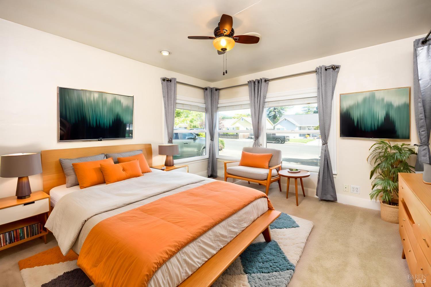 165 Luce Avenue Ukiah, CA 95482 - Photo 16 of 26 a bedroom with a bed and a flat screen tv