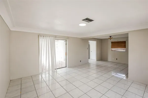 a view of an empty room and window