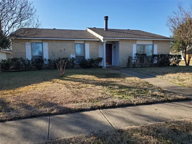 a front view of a house with yard