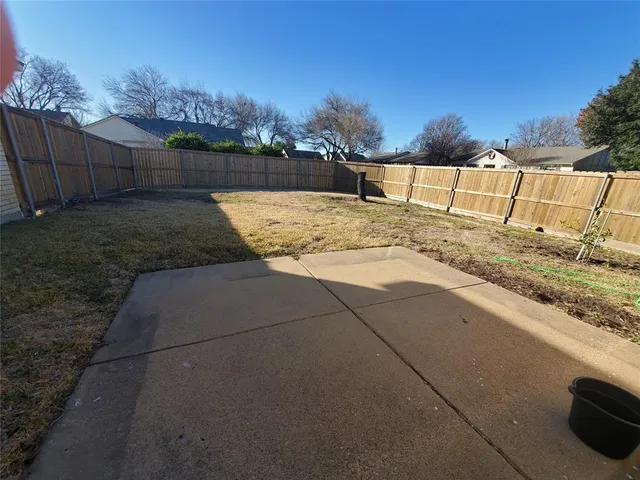 a view of swimming pool with a yard
