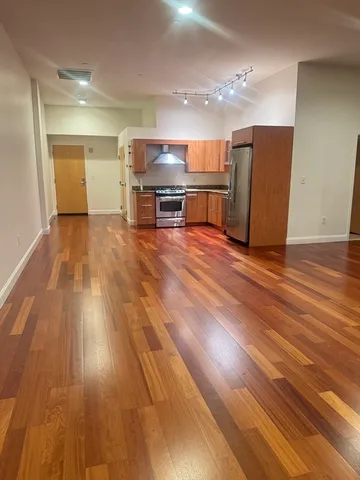 a view of kitchen with wooden floor