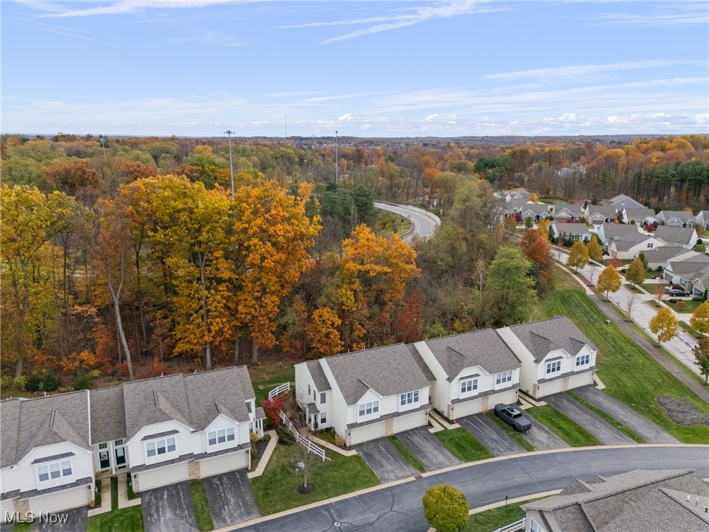 4038 Gardiner Run Akron, OH 44321 - Photo 33 of 38 Aerial view of residential area featuring a forest