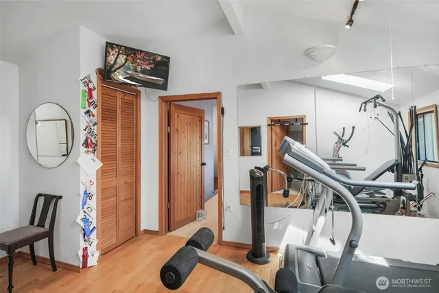 a view of an entryway with wooden floor