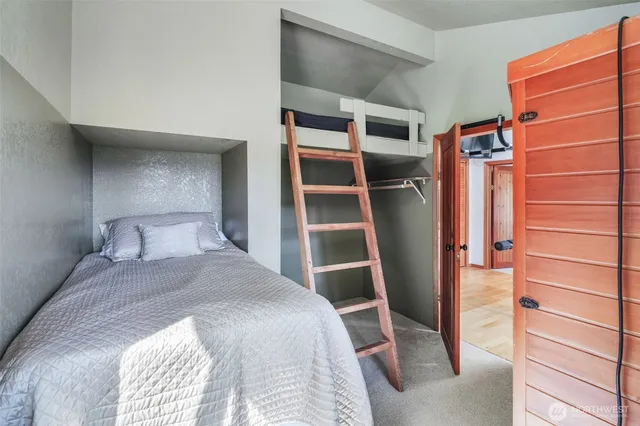 a bedroom with a bed and a closet