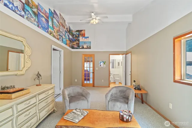 a bedroom with furniture and a window