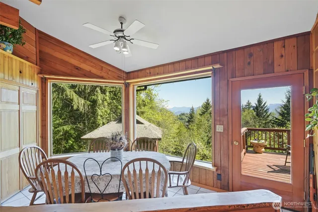 a view of a dining room with furniture window and outside view