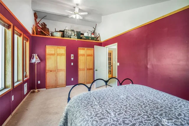 a view of a room with furniture and chandelier