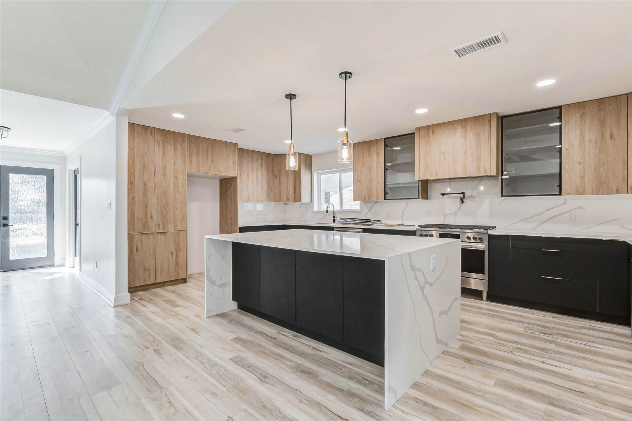 6106 Rutherglenn Drive Houston, TX 77096 - Photo 14 of 43 a kitchen with stainless steel appliances granite countertop a sink a stove a refrigerator and cabinets