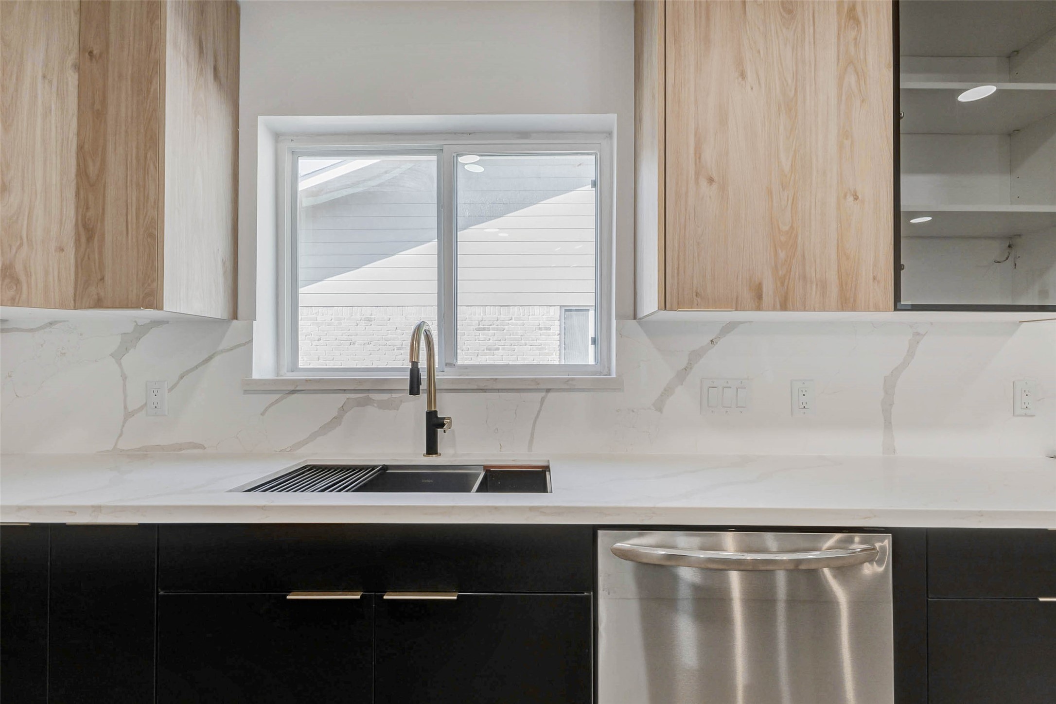 6106 Rutherglenn Drive Houston, TX 77096 - Photo 19 of 43 a sink with a window and wooden floor
