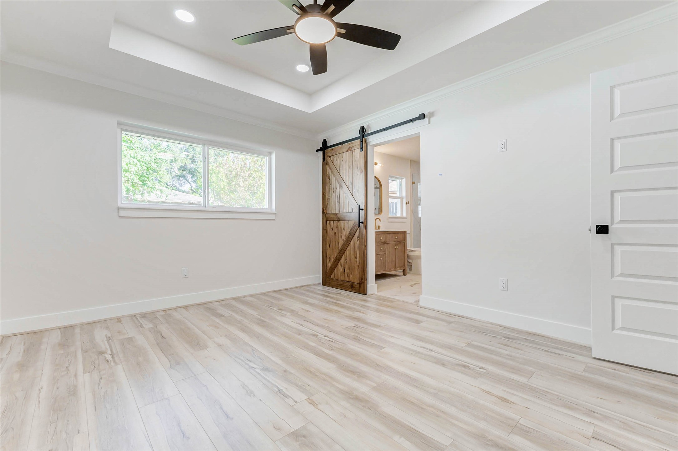 6106 Rutherglenn Drive Houston, TX 77096 - Photo 23 of 43 wooden floor in an empty room with a window