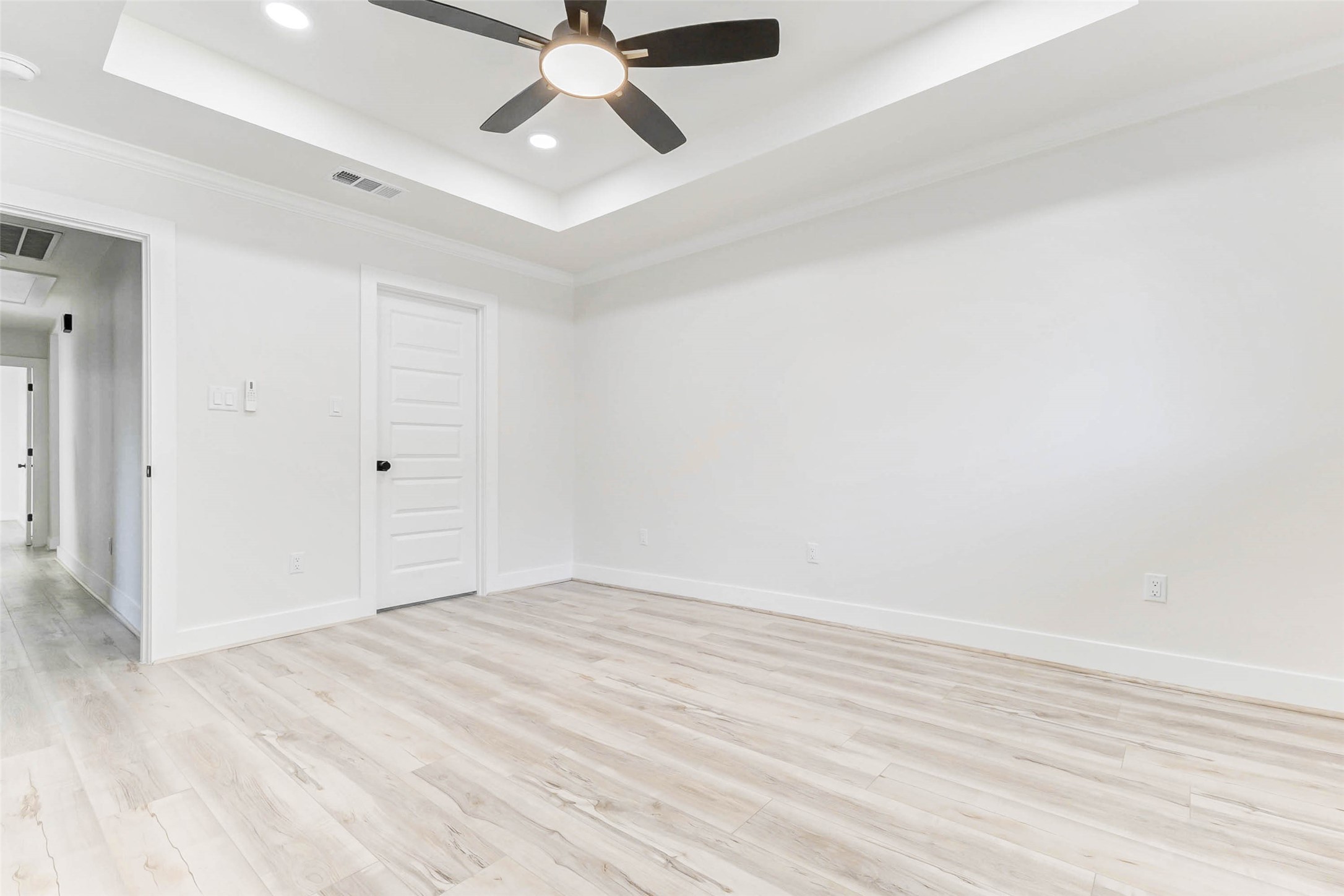 6106 Rutherglenn Drive Houston, TX 77096 - Photo 25 of 43 an empty room with wooden floor and windows