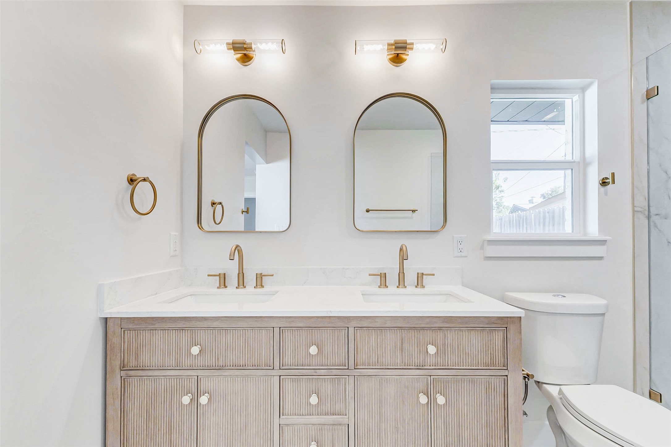 6106 Rutherglenn Drive Houston, TX 77096 - Photo 27 of 43 a bathroom with 2 sink toilet and a mirror